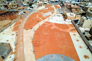 Aerial record of Alhamra Park during the works: coloured hardscape laid and curved walkways shaped